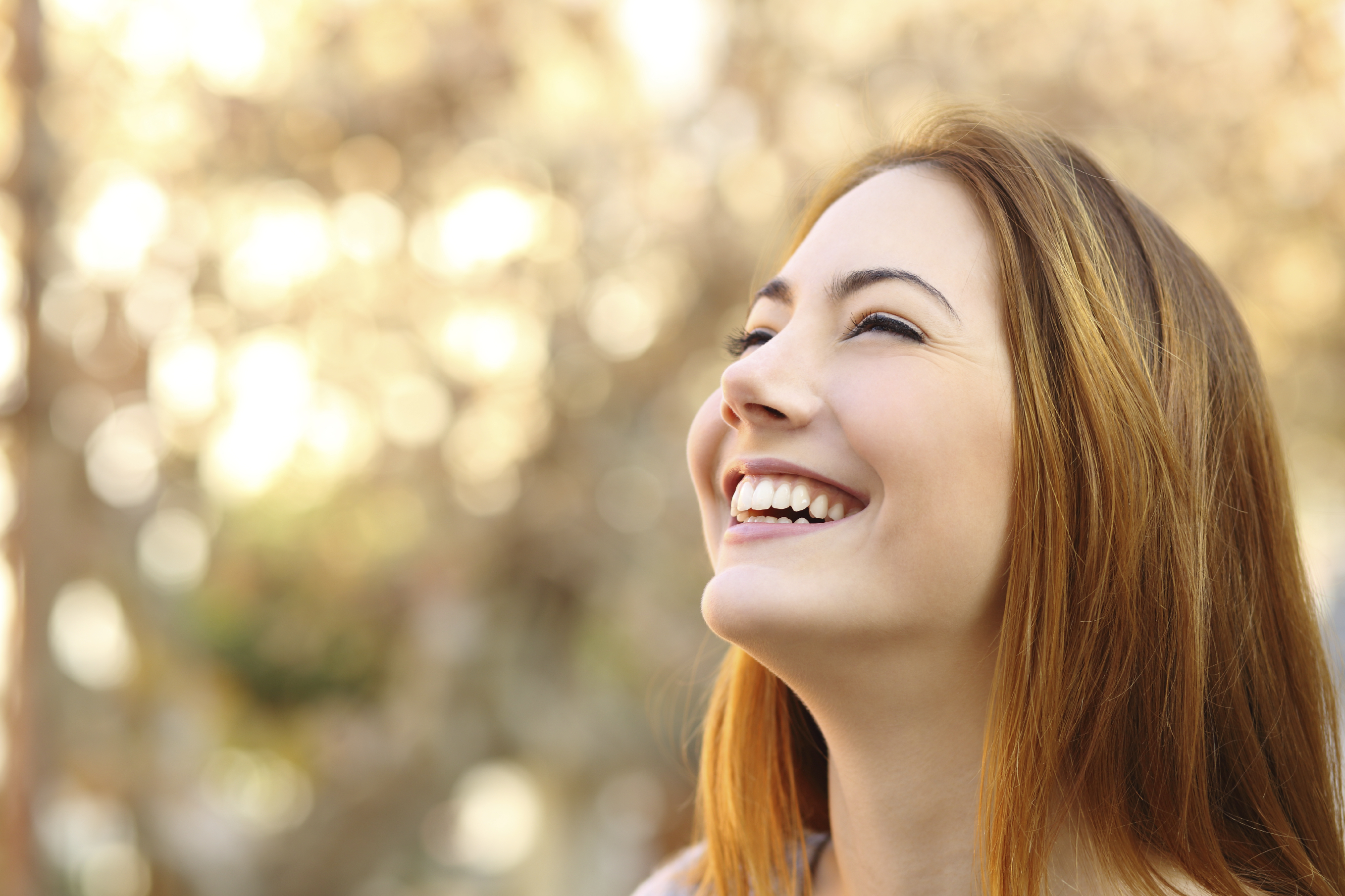 woman-smiling-looking-up